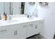 Modern bathroom featuring a double sink vanity, white cabinets, and sleek hardware at 5790 Thornton Dr, Cumming, GA 30028