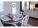 Elegant dining area featuring a round table with seating for six and stylish decor at 5790 Thornton Dr, Cumming, GA 30028