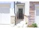 Inviting entryway with a modern front door, brick accents, and a friendly welcome sign at 5790 Thornton Dr, Cumming, GA 30028