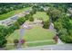 Sprawling estate with a long driveway, lush landscaping, and mature trees at 3898 Bay Creek Rd, Loganville, GA 30052