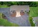 Stunning aerial view showcases the home's unique curb appeal, landscaping, and surrounding greenery at 3898 Bay Creek Rd, Loganville, GA 30052