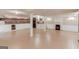 Spacious basement with white columns, modern lighting, cabinets, and a fireplace at 3898 Bay Creek Rd, Loganville, GA 30052