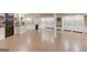 Finished basement featuring tile flooring, cabinets, and a bar area next to the white shelving at 3898 Bay Creek Rd, Loganville, GA 30052