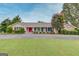 Charming single-story home with well-manicured lawn and a bright red front door at 3898 Bay Creek Rd, Loganville, GA 30052