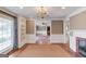 Traditional living room with fireplace, built-in bookshelves, and hardwood floors at 3898 Bay Creek Rd, Loganville, GA 30052