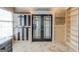 Stylish office features decorative tile accents, French doors, built-in shelving and tile flooring at 3898 Bay Creek Rd, Loganville, GA 30052