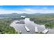 Expansive aerial view showcasing the lake, docks, and lush greenery of this lakeside community at 5400 Kings Camp Rd Se #C1 Se Rd, Acworth, GA 30102