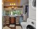 Bathroom with storage cabinets and drawers, plus large window overlooking nature at 5400 Kings Camp Rd Se #C1 Se Rd, Acworth, GA 30102