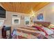 Cozy bedroom with wooden ceiling, natural light, and quilted bedspread at 5400 Kings Camp Rd Se #C1 Se Rd, Acworth, GA 30102