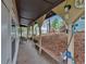 This large covered porch provides a perfect outdoor space for relaxation and enjoying the wooded scenery at 5400 Kings Camp Rd Se #C1 Se Rd, Acworth, GA 30102