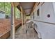 Relax on this cozy covered porch with wooded views, perfect for enjoying the outdoors at 5400 Kings Camp Rd Se #C1 Se Rd, Acworth, GA 30102