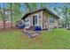 A charming lake house featuring a neat lawn, slider access, steps, and natural landscaping at 5400 Kings Camp Rd Se #C1 Se Rd, Acworth, GA 30102