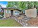 Charming home featuring a lovely yard, stone walkway, and shed at 5400 Kings Camp Rd Se #C1 Se Rd, Acworth, GA 30102