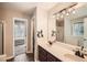 Bathroom with double vanity sinks and combination shower/tub at 6790 India Ln, Cumming, GA 30041