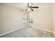 Bedroom featuring carpeted floor, neutral walls, one window, and a ceiling fan at 6790 India Ln, Cumming, GA 30041