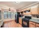 Eat-in kitchen featuring a large window and stainless steel appliances at 6790 India Ln, Cumming, GA 30041