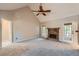 Spacious living room features vaulted ceilings, fireplace, and neutral carpeting at 6790 India Ln, Cumming, GA 30041