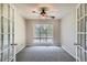 Bright office space with a ceiling fan and plenty of natural light from a large window at 6790 India Ln, Cumming, GA 30041