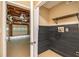 View of an unfinished basement area with garage access, showcasing potential for customization at 90 Camden Woods Pl, Dallas, GA 30157