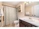 Bathroom featuring a shower/tub, vanity, and decorative floral shower curtain at 90 Camden Woods Pl, Dallas, GA 30157