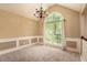 Elegant dining room with large window, neutral walls, and modern chandelier, perfect for entertaining guests at 90 Camden Woods Pl, Dallas, GA 30157