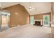 Inviting living room featuring a fireplace, plush carpeting, and a door to the backyard allowing for seamless indoor-outdoor living at 90 Camden Woods Pl, Dallas, GA 30157