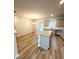 Open concept kitchen featuring stainless steel appliances, granite countertops, and luxury vinyl plank flooring at 123 Deer Xing, Temple, GA 30179