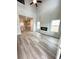 Bright living room with high ceilings, modern fireplace, and luxury vinyl plank flooring throughout at 123 Deer Xing, Temple, GA 30179