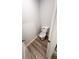 A clean toilet room features neutral walls, wood-look floors and a standard toilet at 123 Deer Xing, Temple, GA 30179