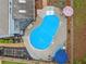 Aerial view showcasing the pool, outdoor seating areas, landscaping, and the house at 1482 Pinebark Ct., Grayson, GA 30017