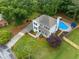 Stunning aerial view of a home featuring a beautiful pool and well-maintained landscaping at 1482 Pinebark Ct., Grayson, GA 30017