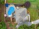 Aerial view of the property with a backyard pool, patio, and well-maintained landscaping at 1482 Pinebark Ct., Grayson, GA 30017
