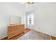 Bright bedroom with hardwood floors, neutral walls, ceiling fan, and ample natural light at 1482 Pinebark Ct., Grayson, GA 30017