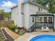 Home exterior with a pool, garden area, and a deck attached to the house at 1482 Pinebark Ct., Grayson, GA 30017