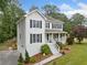 Charming two-story home with a covered front porch, manicured landscaping, and a well-kept lawn at 1482 Pinebark Ct., Grayson, GA 30017