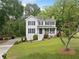 Charming two-story home with a well-manicured lawn and inviting front porch at 1482 Pinebark Ct., Grayson, GA 30017