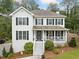 Charming two-story home with a welcoming front porch and well-manicured landscaping at 1482 Pinebark Ct., Grayson, GA 30017