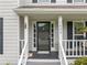 Inviting front porch with decorative details and charming curb appeal at 1482 Pinebark Ct., Grayson, GA 30017