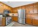 Traditional kitchen with stainless steel appliances, granite countertops, and lots of storage at 1482 Pinebark Ct., Grayson, GA 30017