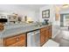 Open-concept kitchen featuring a breakfast bar and stainless steel appliances at 1482 Pinebark Ct., Grayson, GA 30017