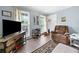 Cozy living room with natural light and comfortable seating at 1482 Pinebark Ct., Grayson, GA 30017