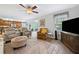 Open-concept living room and kitchen with wood flooring and lots of natural light at 1482 Pinebark Ct., Grayson, GA 30017