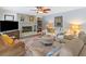 Comfortable living room with a brick fireplace, and a large area rug at 1482 Pinebark Ct., Grayson, GA 30017