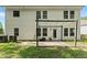 A home's backyard features a patio with a pergola, offering a cozy outdoor living space, and the exterior has vinyl siding at 3235 Avondale Pkwy, Powder Springs, GA 30127