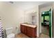 Bathroom showcasing double sinks, decorative mirror lighting, and neutral tones at 3235 Avondale Pkwy, Powder Springs, GA 30127