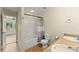 Bathroom featuring a tub and shower combo, double sink vanity, and natural light at 3235 Avondale Pkwy, Powder Springs, GA 30127