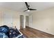 Bright bedroom with hardwood floors, ceiling fan, and ample closet space at 3235 Avondale Pkwy, Powder Springs, GA 30127
