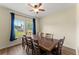 Traditional dining room features a dark wood table and chairs, plus large window views at 3235 Avondale Pkwy, Powder Springs, GA 30127