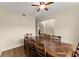 Formal dining room showcases wood flooring and a spacious wood table for entertaining at 3235 Avondale Pkwy, Powder Springs, GA 30127