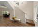 Bright foyer with hardwood floors, staircase, and views into the living area, creating a welcoming entrance at 3235 Avondale Pkwy, Powder Springs, GA 30127